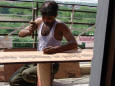 Picture of carpenter driving nails in wood